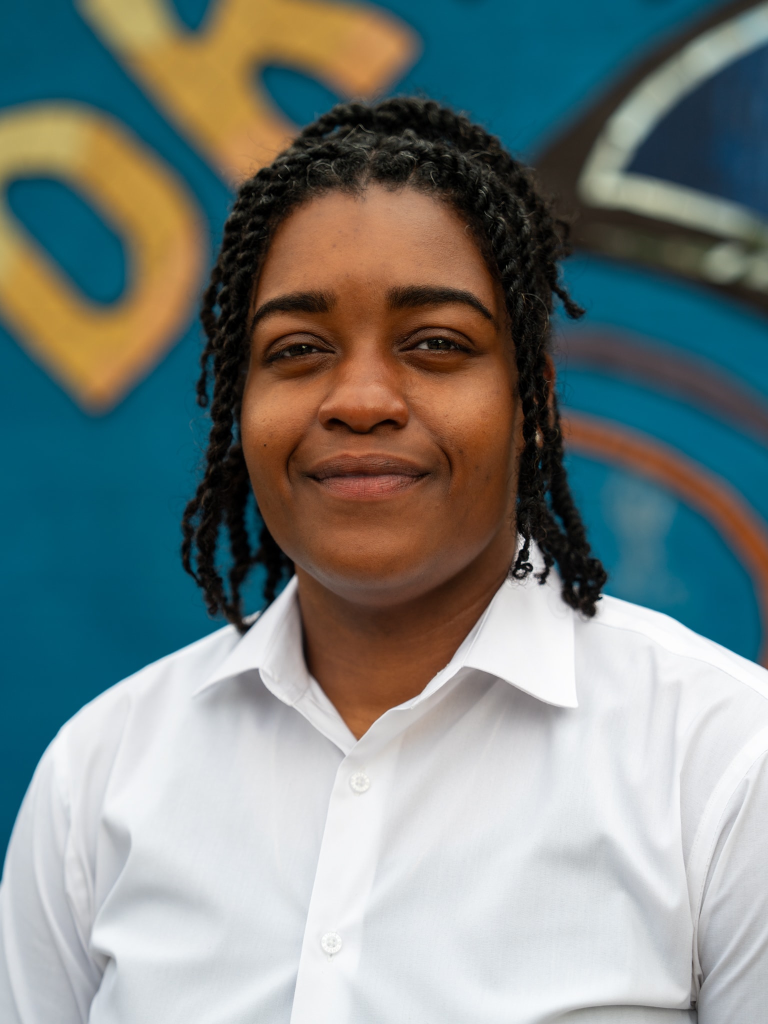 Formal portrait — mural backdrop